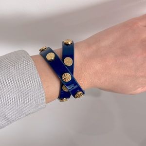 Tory Burch wrap bracelet with studded logos.